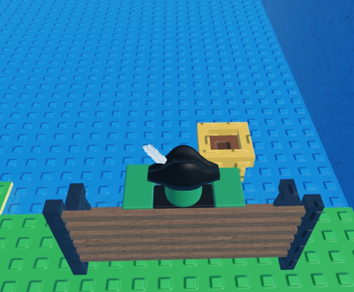 nuke holding an empty pot while sitting at a bench by the lake.